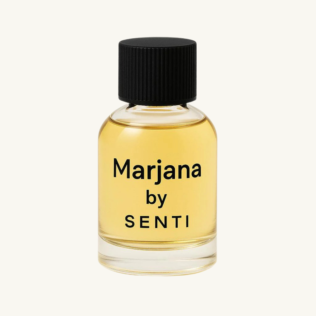 A single clear glass bottle of Senti Marjana perfume, featuring a black ridged cap and golden liquid, against a clean off-white background.