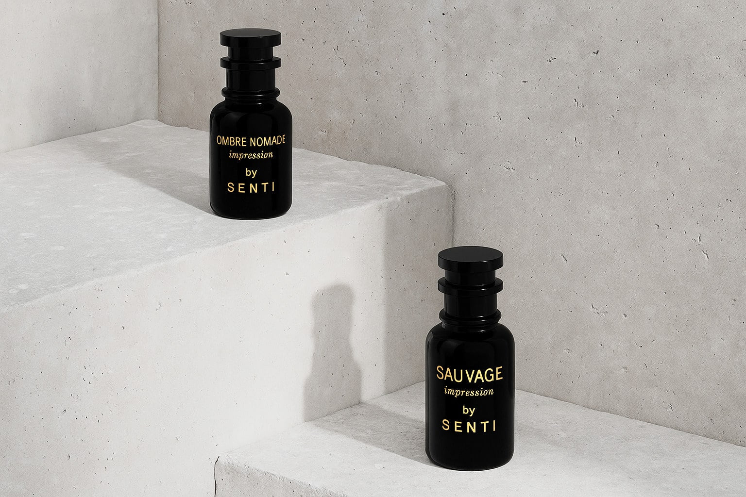 Two black Senti perfume bottles, 'Ombre Nomade impression' and 'Sauvage impression', displayed on a textured concrete staircase, highlighting both fragrances.